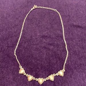 Silver necklace with pink hearts